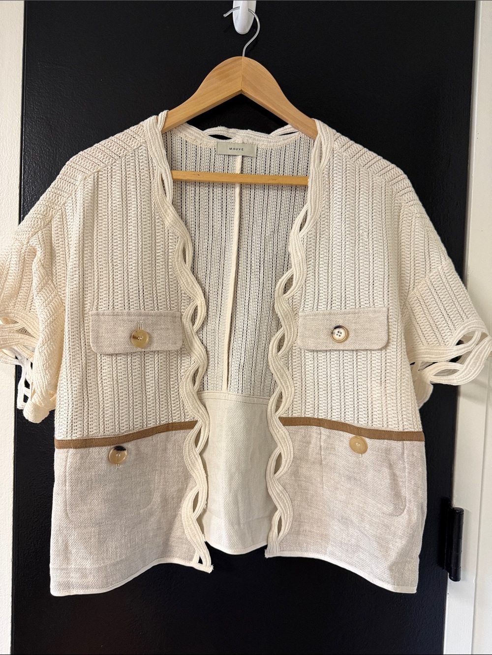 cream-colored MAUVE short-sleeve knit cardigan featuring a textured